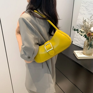 Minimalist bright yellow baguette shoulder bag with large silver buckle for women