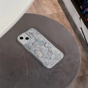 Detail of 3D pearl luster butterflies on a textured stone-finish iPhone protective case
