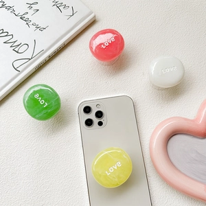 Set of pastel heart Love phone sockets on a white phone with aesthetic lifestyle props