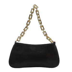 Minimalist black underarm bag with a bold matte finish and chunky gold chain strap