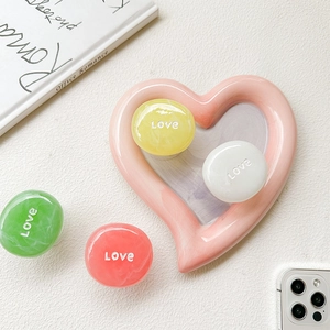 Collapsible marble texture phone grip set with Love print on heart-shaped display tray
