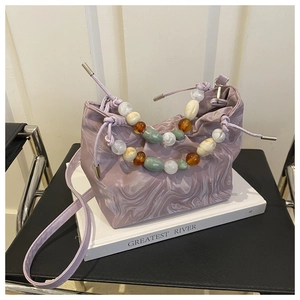Detail of light purple marble pattern bucket bag with colorful beads handle and drawstring
