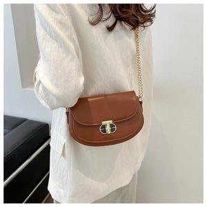 Brown semi-circle saddle bag with gold chain strap and elegant metallic oval lock detail