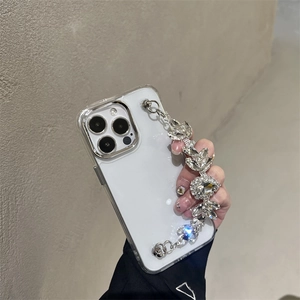 Luxury transparent iPhone case with glittering rhinestone hand chain and metal lens frame