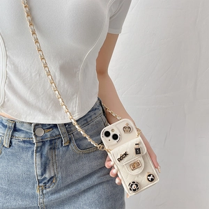Quilted white crossbody iPhone 16 Pro Max case with chain strap and Rock charms