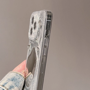 Detailed side view of iPhone case with silver glitter liquid and heart mirror detail