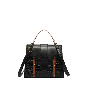 Fashionable black crocodile pattern crossbody bag with brown accents and gold rivets