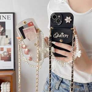 Detail of floral phone case with pearl strap and integrated card wallet for iPhone