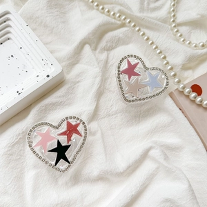 Glitter star heart phone socket holder with rhinestone edge on marble and pearl background