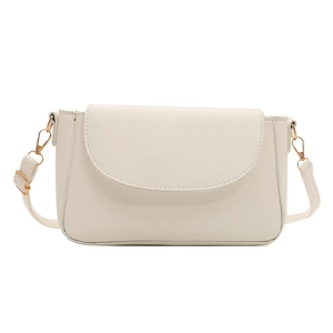 Minimalist beige crossbody shoulder bag with golden hardware and adjustable strap