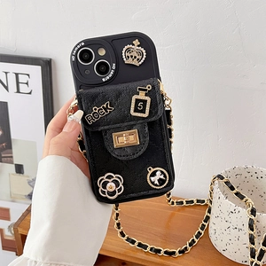 Black pebbled leather crossbody iPhone case with gold crown and camellia charms