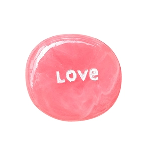 Pink marble style expandable phone grip with white LOVE text on a polished round surface