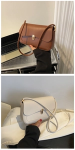 Detail view of brown and cream shoulder bags with stylish metallic twist lock closures
