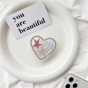 Detail of heart-shaped glitter phone socket with three-color star and rhinestone edge