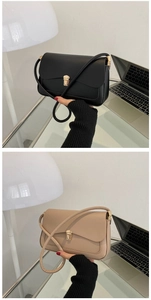 Detail of minimalist flap shoulder bags in black and beige with vintage gold metal buckles