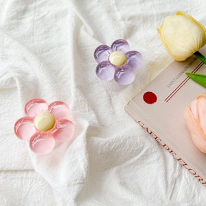 Pink and purple 3D resin flower phone grip holder on aesthetic floral background