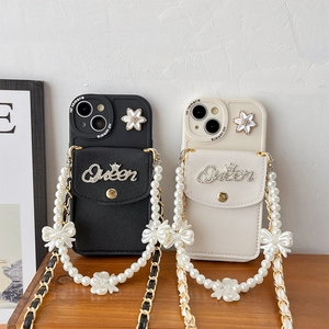 Detail of luxury phone case with Queen card holder, pearl chain and camellia bow charm