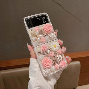 Detail of luxury Samsung Z Flip case with inlaid pearls, pink roses, and crystal accents