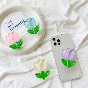 Detail of tulip flower phone grip showing translucent resin texture and pastel colors