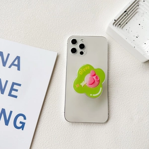 Collapsible green flower phone socket with a pink heart and O!yes text on a white surface