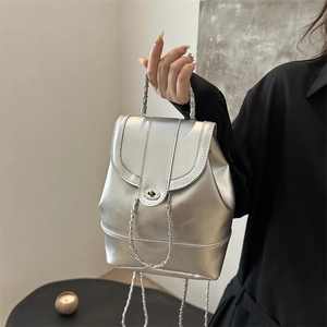 Silver metallic mini backpack with chain handle and twist lock closure for women