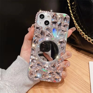 Detailed view of luxury rhinestone iPhone case with built-in circular vanity mirror