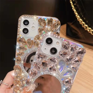 Close-up of luxury hand-set champagne rhinestones and round mirror on iPhone case