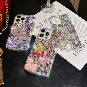 Luxury iPhone case featuring 3D butterflies, pearls, and roses with diamond encrusting