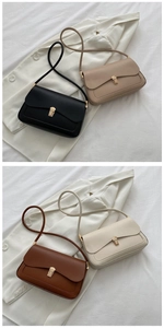 Detail of minimalist shoulder bags with metallic gold buckles in four classic colors