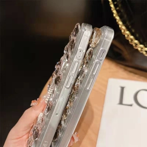 Detail of luxury iPhone case with rabbit ears and large sparkling rhinestone crystals