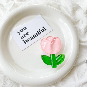 Detailed view of a pink tulip-shaped phone socket made of translucent glossy acrylic