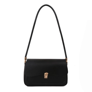 Minimalist black leather shoulder bag with sleek gold buckle and long handle for women