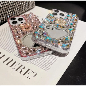 Luxury rhinestone iPhone case featuring a built-in makeup mirror and crystal bear charm