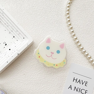 Detailed view of cute white cat griptok phone stand on a white decorative background