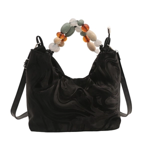 Black marble texture bucket bag with colorful beaded handle and adjustable shoulder strap