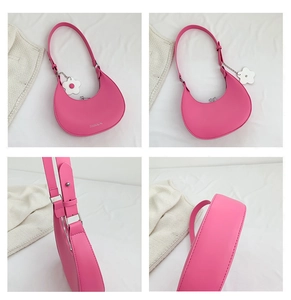 Detailed views of a pink crescent underarm bag with small flower charm and silver logo