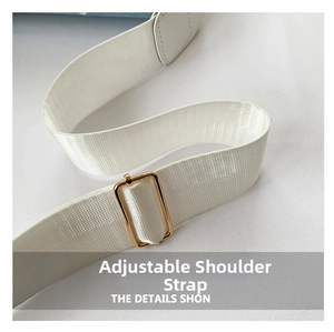 Detail of white woven adjustable strap with premium gold metal buckle for shoulder bag