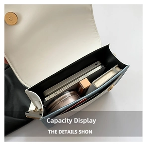 Internal view of crossbody bag showing capacity for phone, cosmetics and notebook