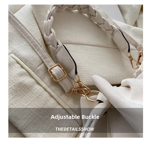 Detail of adjustable metal buckle and woven strap on off-white crossbody bag