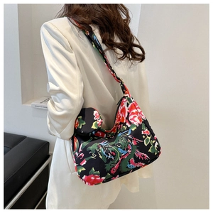 Detailed shot of ethnic floral canvas underarm bag with a matching small round coin purse