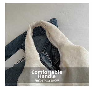 Close-up detail of white pleated texture and comfortable handle on a cloud-style handbag