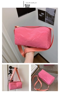 Detailed views of a rose red cylindrical PU shoulder bag with shiny crinkled texture