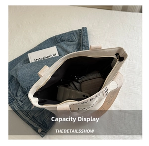 Top view of large canvas tote bag interior showing ample storage for daily essentials
