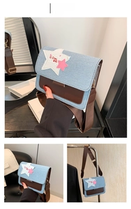 Detail of coffee brown leather and blue denim patchwork bag with star pattern
