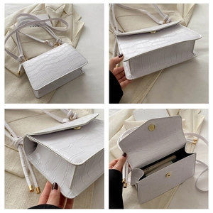 Detailed views of white crocodile pattern shoulder bag featuring gold magnetic closure