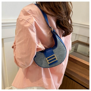 Hobo shoulder bag featuring blue leather and grey wool texture stitching detail