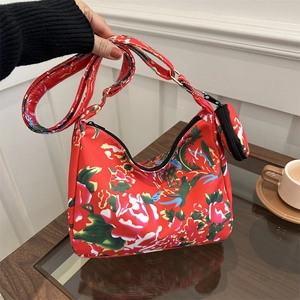 Floral nylon crossbody bag with red flower pattern and round coin purse attachment