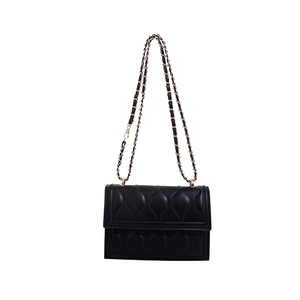 Chic black quilted shoulder bag with leaf-pattern stitching and gold chain strap