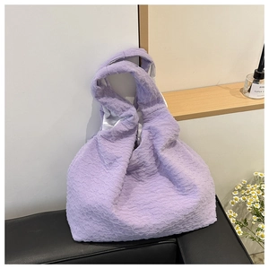 Detail of light purple bubble textured tote bag showing unique ruffled fabric pattern