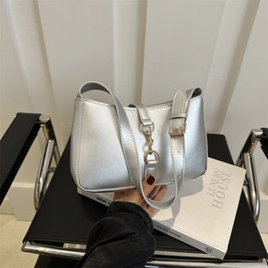 Metallic silver underarm bag with adjustable strap and gold metal buckle detail